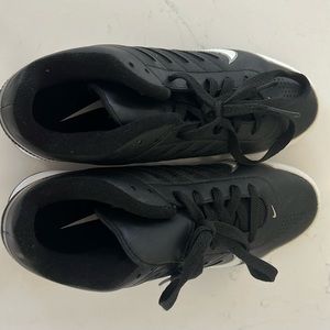 Black and white boys nike soccer cleats and no box
